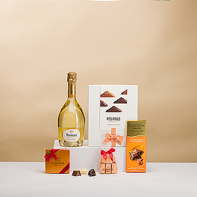 Offrez à vos amis, à votre famille et à vos collègues ce cadeau VIP à base de champagne et de chocolats pour les occasions spéciales. Une prestigieuse bouteille de champagne Ruinart est présentée avec les emblématiques Irrésistibles de Neuhaus et des chocolats Godiva de première qualité.