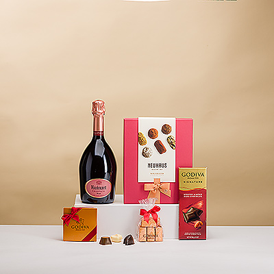 Choyez vos proches avec ce cadeau unique au champagne. Une bouteille prestigieuse de champagne Ruinart Rosé est présentée avec des truffes de luxe Neuhaus et du chocolat Godiva de première qualité.